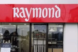 Raymond shares debut at 4% discount on NSE after demerger