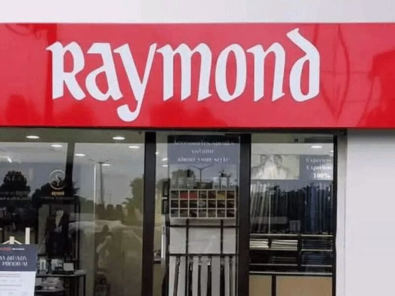 Raymond shares debut at 4% discount on NSE after demerger